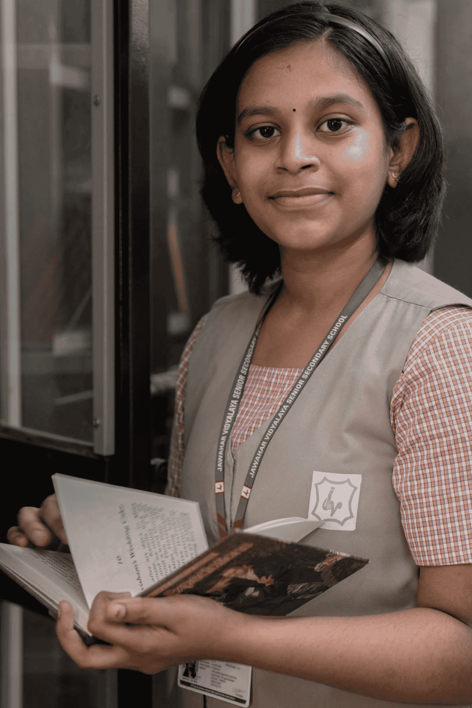 Secondary school student reading book at Jawahar Vidyalaya CBSE Campus in Chennai
